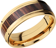 18K Yellow gold 8mm flat band with grooved edges, reverse milgrain detail and an inlay of Natcoco hardwood