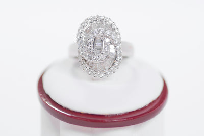 Tapered Baguette Diamonds And Round Diamond Ring