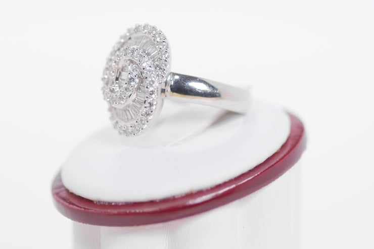 Tapered Baguette Diamonds And Round Diamond Ring