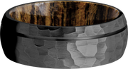 Zirconium 8mm domed band with 1, .5mm groove and a sleeve of Bocote hardwood